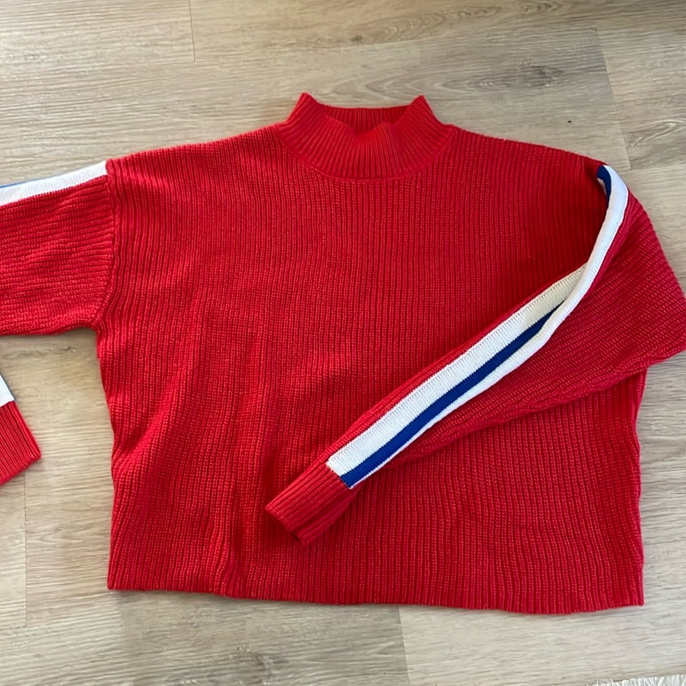 H&M red sweater with blue and white accent on sleeves